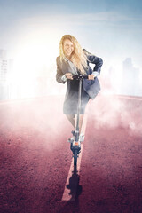 Businesswoman ride a kick scooter at misty morning