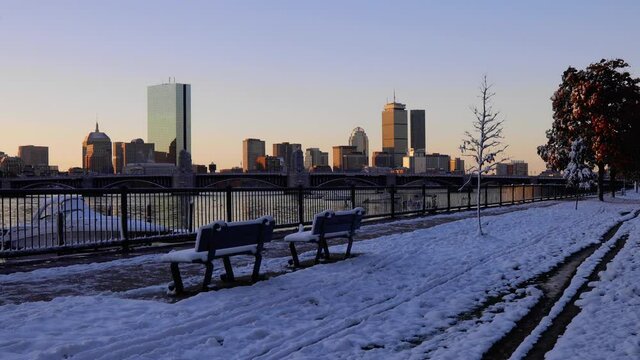 Autumn snow on Charles River with Boston skyline