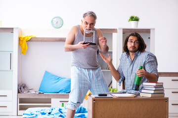Young son student and dad alcoholic