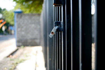 metal door with lock. padlock in the fence