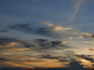 Cumulus cloud with sunbeam on beautiful blue sky at sunset , The horizon becomes orange and gold color at night , Fluffy clouds formations at tropical zone , Thailand