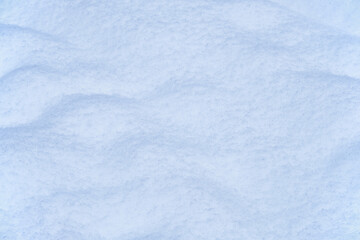 Snow texture. Natural winter background with snow waves
