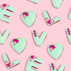 Seamless pattern from painted gingerbread in shape of word love. Love romance concept for Valentines day.