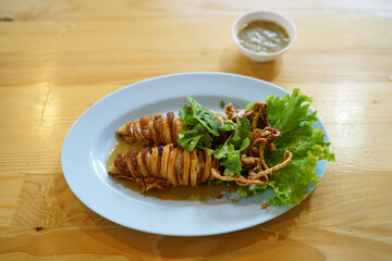 Deep fried squid with fish sauce, Thai food recipe.