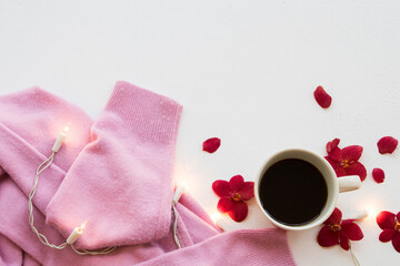 hot coffee ,pink sweater knitting wool of lifestyle woman relax in winter season arrangement flat lay style on background white