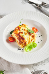 Lasagna with tomato and green leaf
