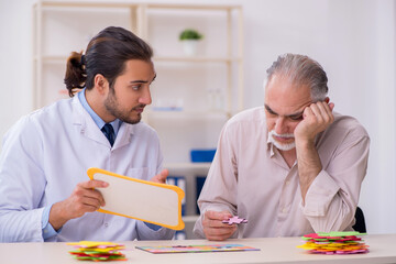 Doctor and patient suffering from Alzheimer disease