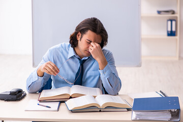 Young businessman student studying at workplace