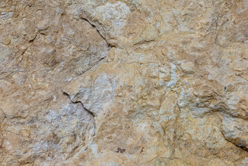 Natural mountain stone,a section of rock texture on a Sunny day.