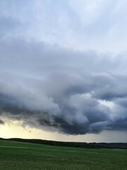 Naklejka na ściany i meble storm clouds over the field