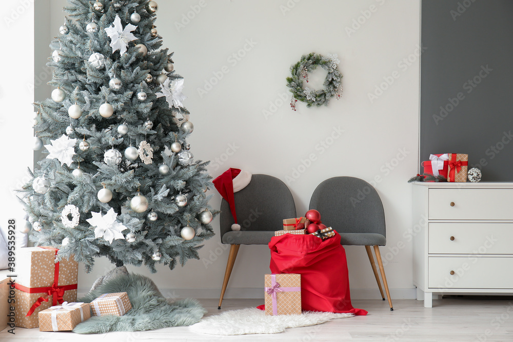 Wall mural interior of modern room with christmas tree and santa bag