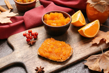Sandwich with tasty pumpkin jam on table