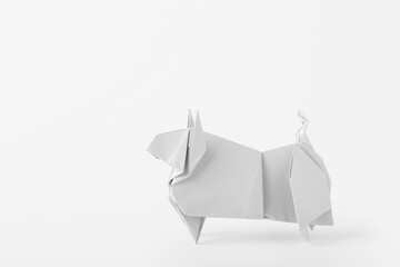 Origami bull as symbol of year 2021 on white background