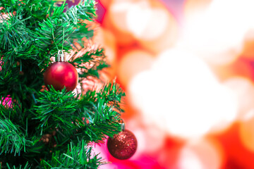 Christmas background ,Decorated Christmas tree on red bokeh blurred background 
