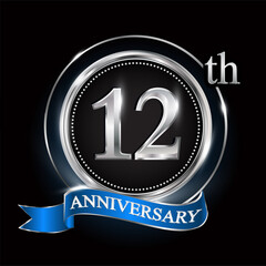 12th anniversary logo with silver ring and blue ribbon.