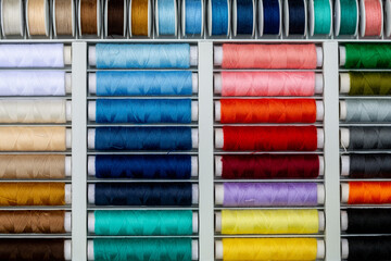A set of threads in different colors. Multicolored threads for sewing and needlework. Small rolls of thread in a different colours. 