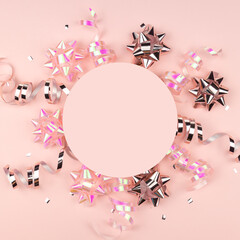 Christmas Holidays Background in pink color. Winter holidays, New Year. Flat lay, top view, copy space. Pink Streamers With Sparkling Glitter.