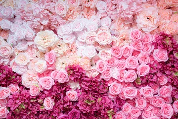 Tuinposter Backdrop of red and pink roses,Flowers wall background,Wedding decoration © showcake