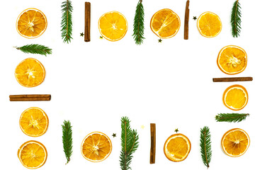 Christmas composition with dried oranges, cinnamon and fur tree branches on white background. food knolling and Christmas decor for home. Flat lay with copy space