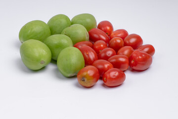 group of green and red cherry tomatoes isolated on white background