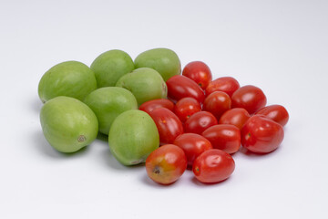 group of green and red cherry tomatoes isolated on white background