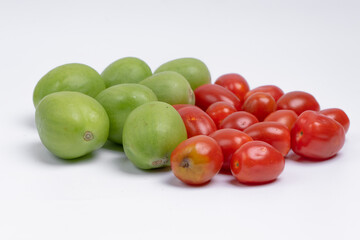 group of green and red cherry tomatoes isolated on white background