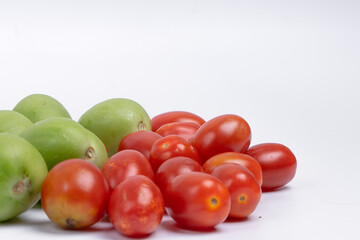 group of green and red cherry tomatoes isolated on white background