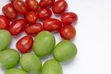 group of green and red cherry tomatoes isolated on white background