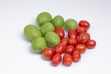 group of green and red cherry tomatoes isolated on white background