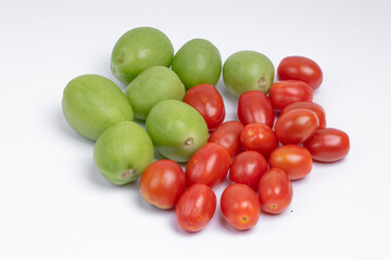 group of green and red cherry tomatoes isolated on white background