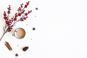 Autumn composition. Cup of coffee, berries on white background. Christmas, winter concept. Flat...