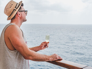 cocktail, drink, glass, wine, champagne, man, business, hand, crystal, red, rose, young, adult, happy, alcohol, party, vacation, beautiful, ship, sunglasses, white, holding, sun, hat, cruise, liner, d