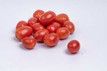 Group of cherry tomatoes isolated on white background