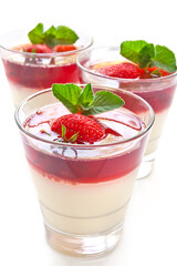 Milk Jelly with strawberry in the glass topped mint leaf
