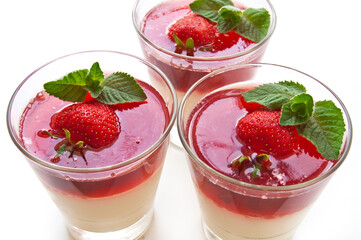 Milk Jelly with strawberry in the glass topped mint leaf