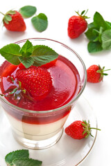 Milk Jelly with strawberry in the glass topped mint leaf