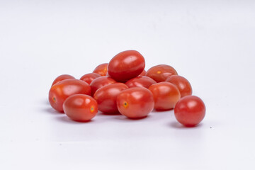 Group of cherry tomatoes isolated on white background