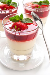 Milk Jelly with strawberry in the glass topped mint leaf