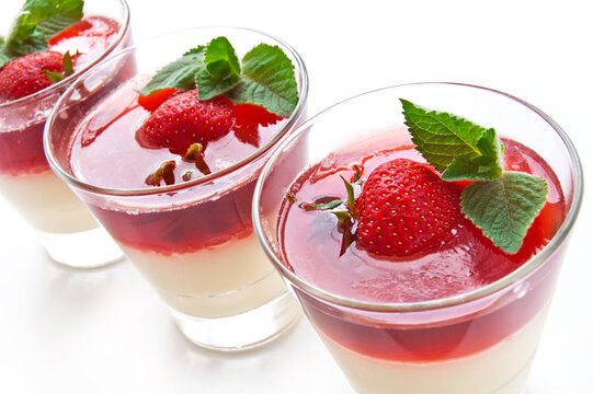 Milk Jelly with strawberry in the glass topped mint leaf