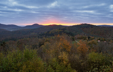 Autumn morning with glowing sunrise at the Palatinate forest in Germany.