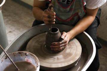 Men hands making Clay Throwing ceramic pot