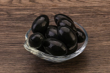 Pickled black olives in the bowl