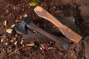 Craving axe on wooden work.