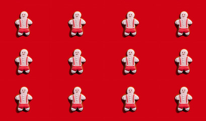 Gay party. Red seamless background. Lgbt solidarity. Bakery food art conceptual ornament. Happy pink gingerbread man cookie creative symmetrical arrangement isolated on bright.