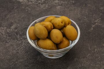 Green pickled olives in the bowl