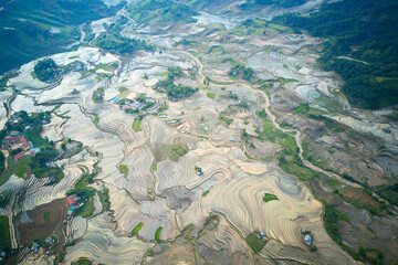 Fototapeta na wymiar Aerial view of rice terraces in mountainous region of Y Ty, Vietnam
