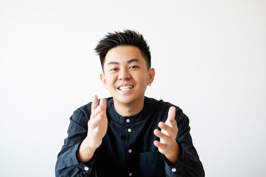 Business Interview. Professional Career. Project Management. Portrait Of Ambitious Cheerful Asian Man Speaking Smiling Looking At Camera Isolated On White Empty Space Background.