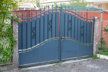 grey steel gate house portal of old traditional european house