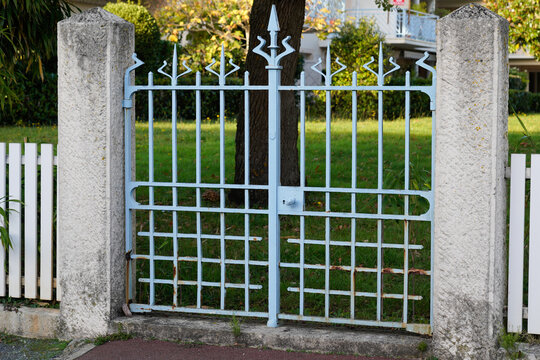blue old vintage steel gate house portal of a traditional european house