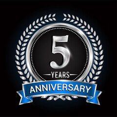 Birthday celebration logo 5th years with wreath, laurel, blue ribbon and silver ring.